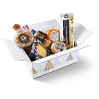 Gift box containing a selection of products, including cheese, a cheese board and cheese knife.