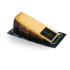 Morceau de fromage Pure Gold dans son emballage