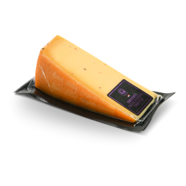 Morceau de fromage Tremendous Truffle dans son emballage