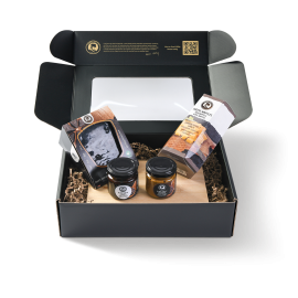 Cadeau de Noël Henri Willig avec produits à l’ail noir dans un coffret cadeau