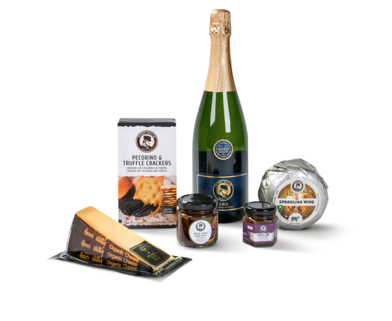 A bottle of cava, 2 types of cheeses, cheese dips, and crackers.