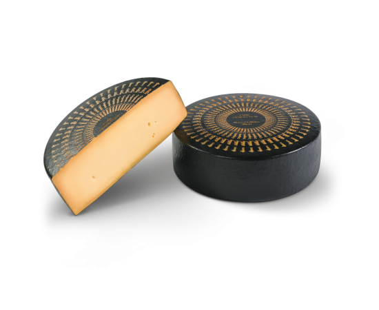 Half and whole Bio Pure Perfection cheese wheel.