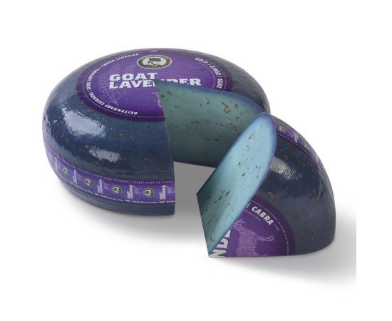 Lavender goat cheese wheel with a piece cut out