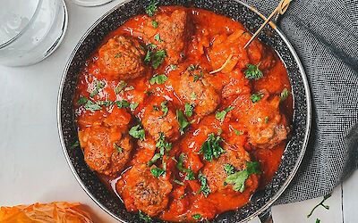 Little meatballs with cheese in tomato sauce