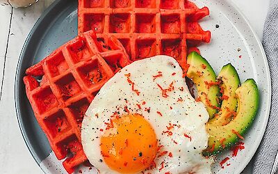 Savoury breakfast waffles with red pesto cheese