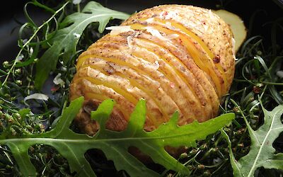 Hasselback potato with red pepper cheese
